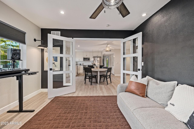 7821 N Via De La Sombre, Scottsdale, AZ 85258 - living room featuring ceiling fan, french doors, light wood-style flooring, recessed lighting, and baseboards