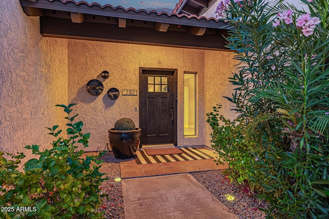 7821 N Via De La Sombre, Scottsdale, AZ 85258 - view of exterior entry featuring stucco siding and a tile roof