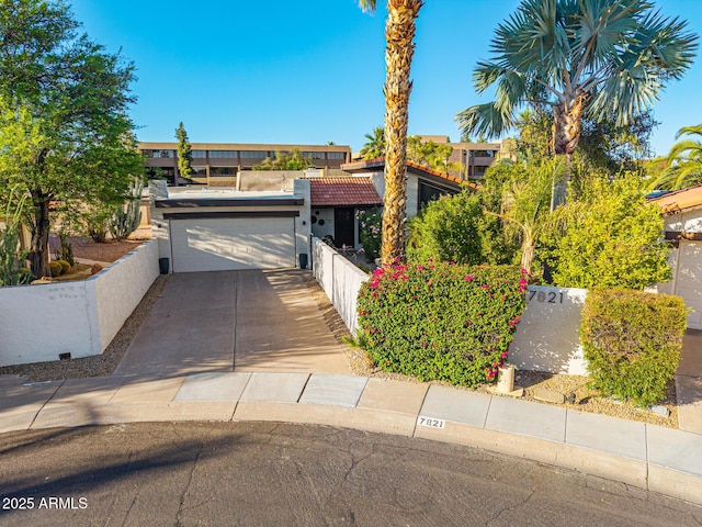 7821 N Via De La Sombre, Scottsdale, AZ 85258 - view of front of home with a garage, driveway, and fence