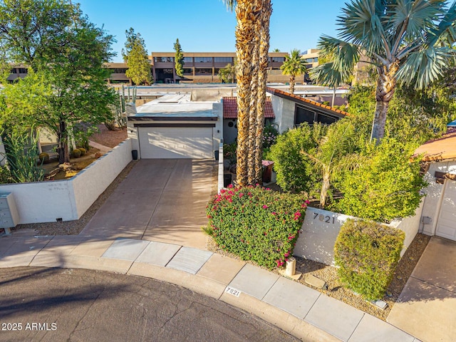 7821 N Via De La Sombre, Scottsdale, AZ 85258 - view of front of home featuring a garage and concrete driveway