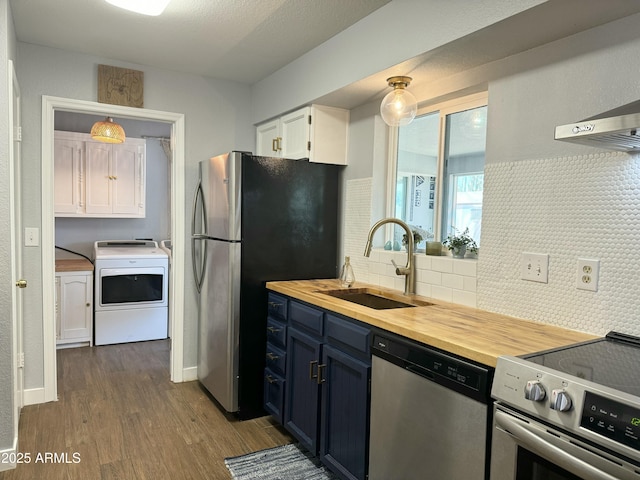 433 S 113th Pl, Mesa, AZ 85208 - kitchen featuring stainless steel appliances, washer / dryer, wood counters, dark wood-style floors, and decorative backsplash