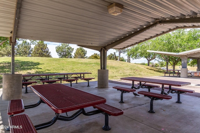 view of community featuring a yard and a patio area