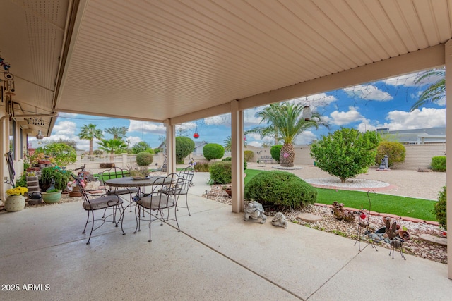 view of patio / terrace featuring outdoor dining space and fence