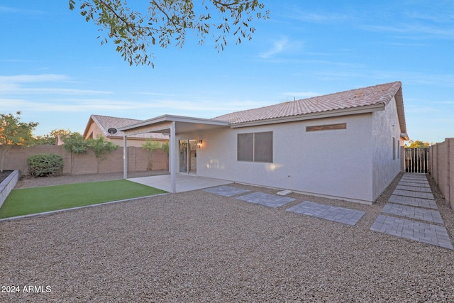 back of property featuring a patio area