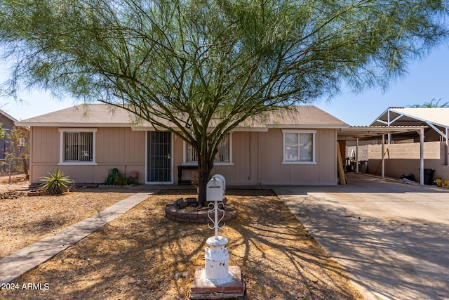 ranch-style house with a carport