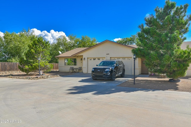 860 W Rd 1 S, Chino Valley, AZ 86323 - ranch-style house featuring a garage, fence, stucco siding, and driveway
