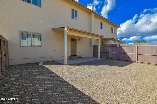 860 W Rd 1 S, Chino Valley, AZ 86323 - back of house featuring entry steps, fence, a patio area, and stucco siding