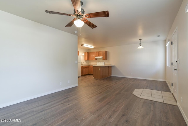 860 W Rd 1 S, Chino Valley, AZ 86323 - unfurnished living room featuring baseboards, dark wood finished floors, ceiling fan, and visible vents