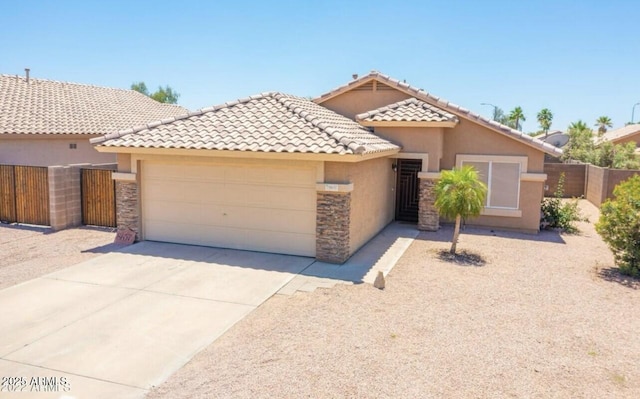 ranch-style home featuring fence, an attached garage, stone siding, stucco siding, and concrete driveway