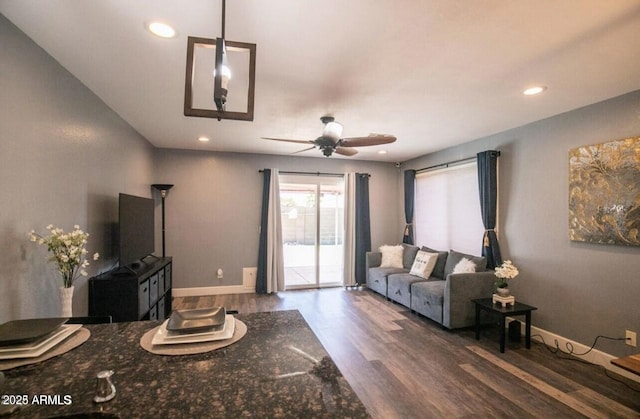 living room with a ceiling fan, baseboards, recessed lighting, and wood finished floors
