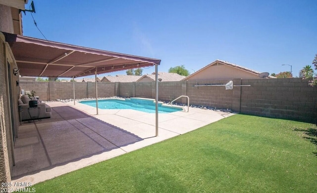 view of swimming pool featuring a fenced backyard, a fenced in pool, a patio, and a yard