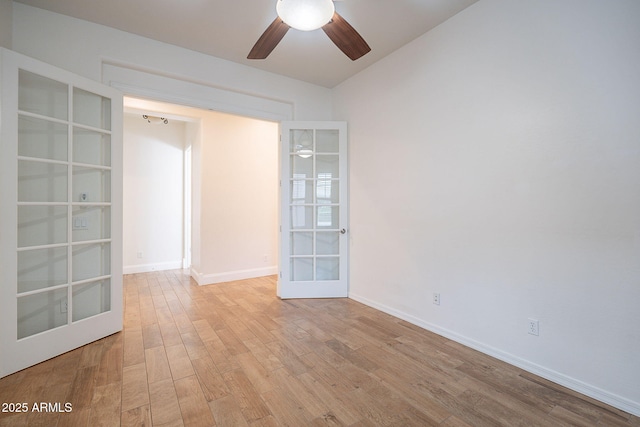 6230 W Montebello Way, Florence, AZ 85132 - empty room featuring french doors, wood finished floors, a ceiling fan, and vaulted ceiling