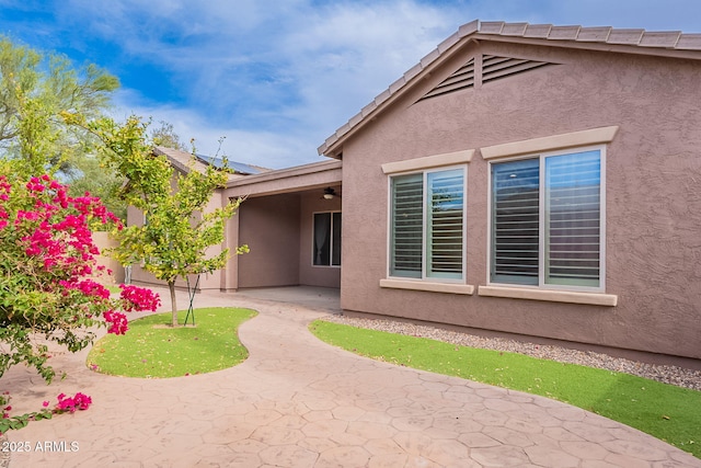 6230 W Montebello Way, Florence, AZ 85132 - back of house with a patio area, stucco siding, and a ceiling fan