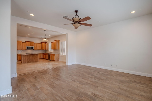6230 W Montebello Way, Florence, AZ 85132 - unfurnished living room featuring ceiling fan, light wood-style flooring, and recessed lighting