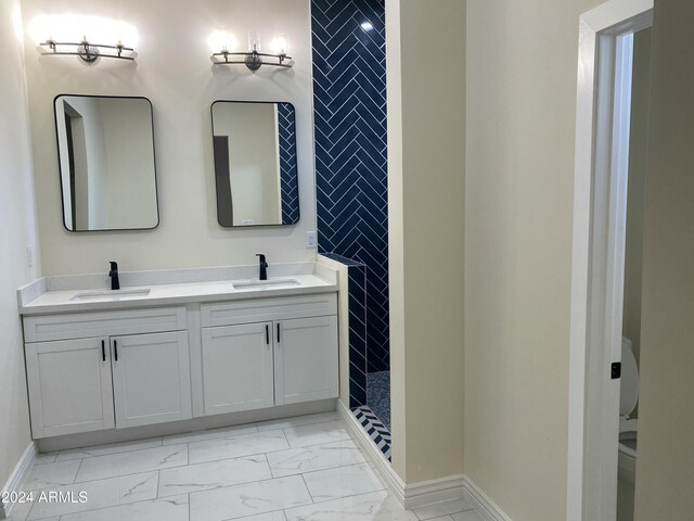 38712 W Sherman St, Tonopah, AZ 85354 - full bath featuring marble finish floors, double vanity, baseboards, and tiled shower