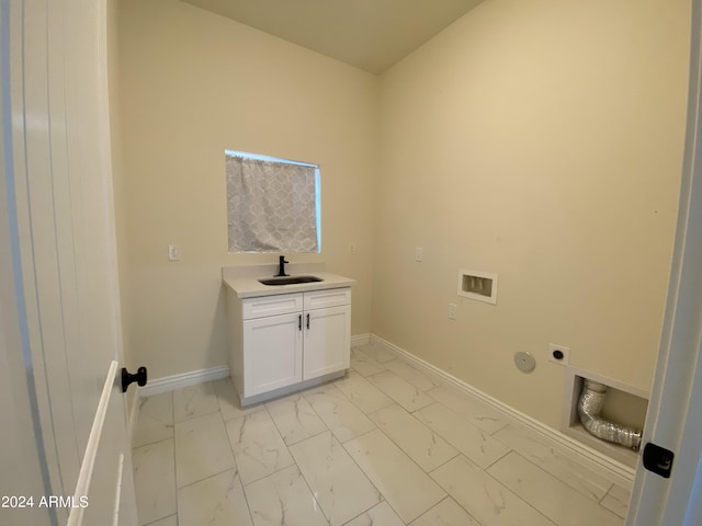 38712 W Sherman St, Tonopah, AZ 85354 - washroom with cabinet space, electric dryer hookup, light marble finish flooring, and baseboards