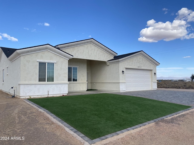 38712 W Sherman St, Tonopah, AZ 85354 - ranch-style house featuring an attached garage, a front lawn, stucco siding, and driveway