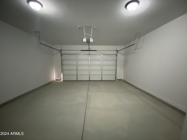 38712 W Sherman St, Tonopah, AZ 85354 - garage with baseboards and a garage door opener