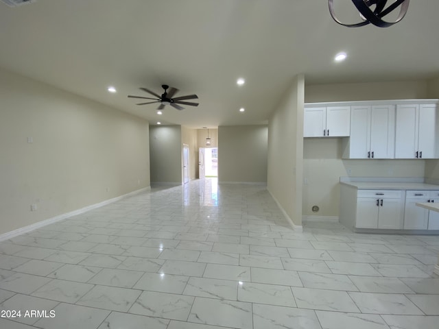 38712 W Sherman St, Tonopah, AZ 85354 - unfurnished living room featuring a ceiling fan, recessed lighting, baseboards, and light marble finish flooring