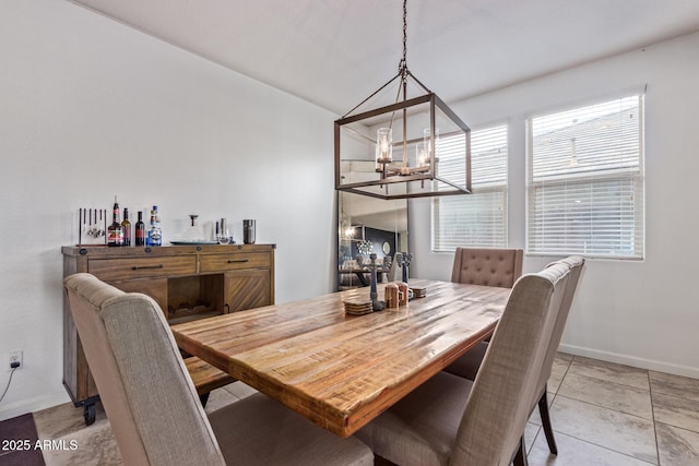 4216 W Harwell Rd, Laveen, AZ 85339 - dining room with a chandelier and baseboards