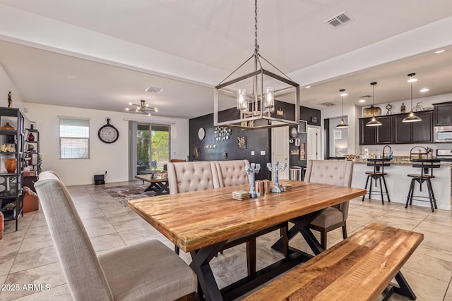 4216 W Harwell Rd, Laveen, AZ 85339 - dining space featuring a chandelier, light tile patterned floors, and recessed lighting