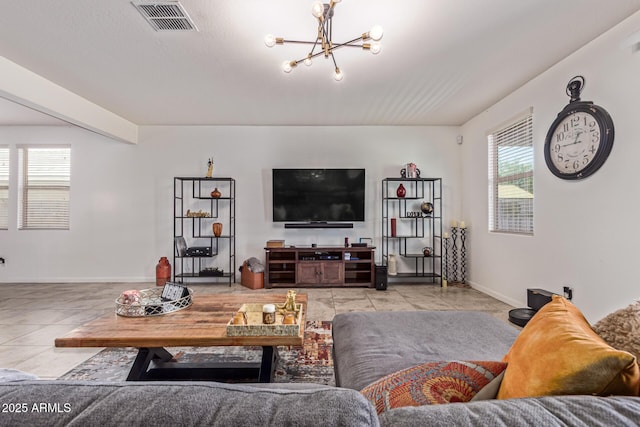 4216 W Harwell Rd, Laveen, AZ 85339 - living area with plenty of natural light, a chandelier, and tile patterned flooring