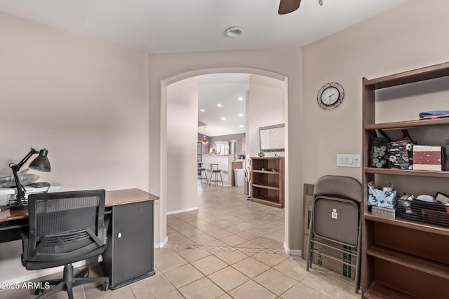 office with ceiling fan and light tile patterned flooring