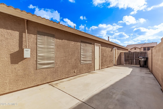 view of property exterior featuring a patio area