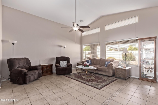 tiled living room featuring high vaulted ceiling and ceiling fan