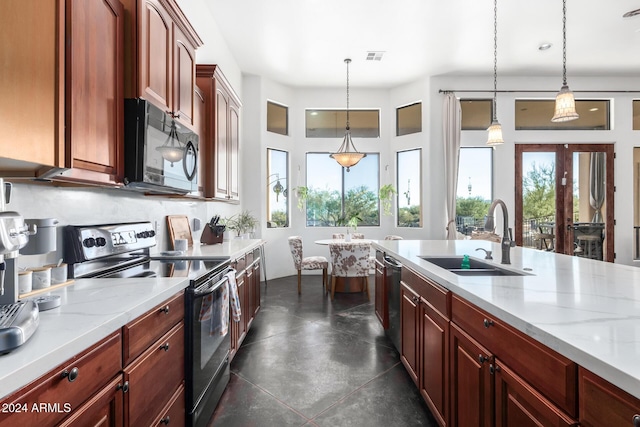 14129 E Barbie Ln, Scottsdale, AZ 85262 - kitchen with range with electric stovetop, black microwave, a sink, and pendant lighting