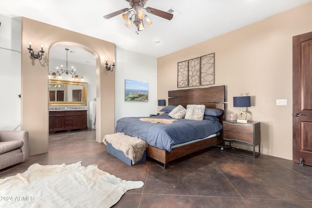 14129 E Barbie Ln, Scottsdale, AZ 85262 - bedroom with concrete flooring, connected bathroom, ceiling fan, and a chandelier