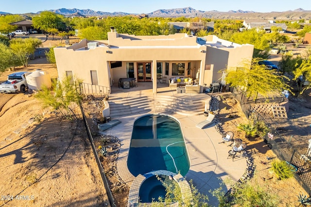 14129 E Barbie Ln, Scottsdale, AZ 85262 - rear view of house with stucco siding, a mountain view, a patio area, and a chimney