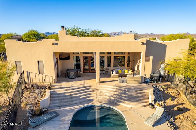 14129 E Barbie Ln, Scottsdale, AZ 85262 - rear view of house featuring stucco siding, french doors, a patio, and a mountain view