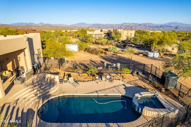 14129 E Barbie Ln, Scottsdale, AZ 85262 - view of pool with a mountain view, a pool with connected hot tub, and a patio