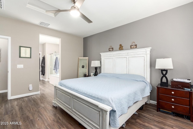 bedroom with ceiling fan, dark hardwood / wood-style flooring, a spacious closet, and a closet