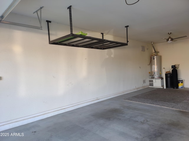 garage with water heater and ceiling fan