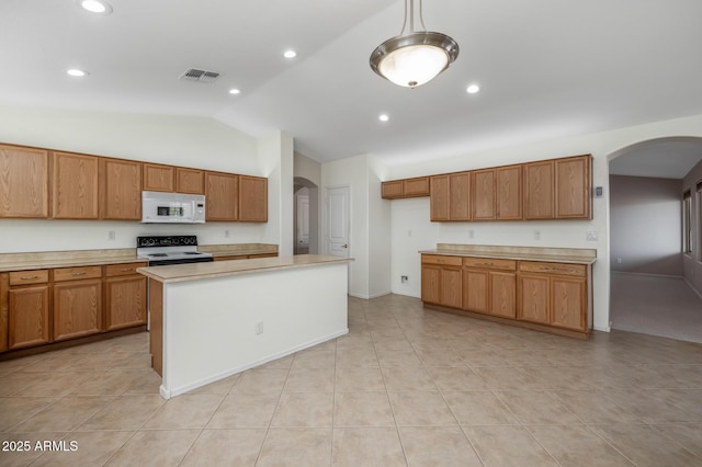 kitchen with vaulted ceiling, a kitchen island, hanging light fixtures, light tile patterned floors, and electric stove