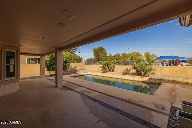 view of pool featuring a patio