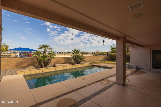 view of pool featuring a patio