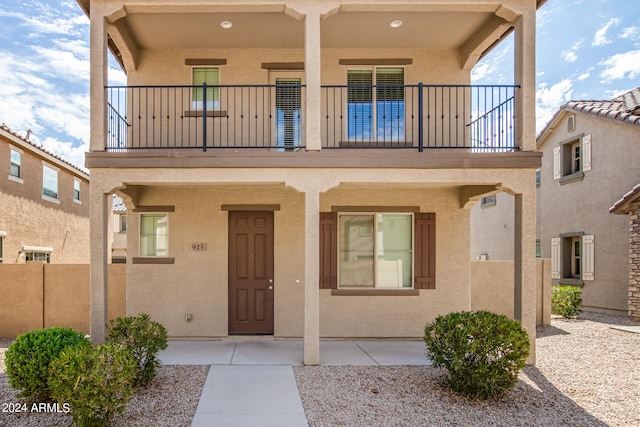 doorway to property featuring a balcony