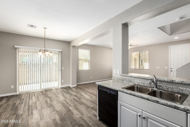 kitchen with dishwasher, hardwood / wood-style flooring, decorative light fixtures, and sink