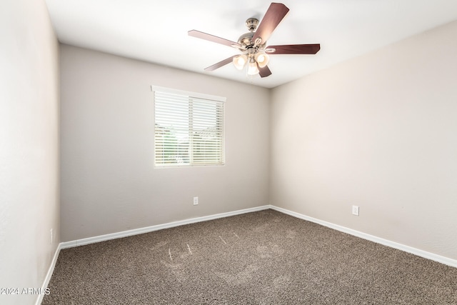 unfurnished room featuring ceiling fan and carpet