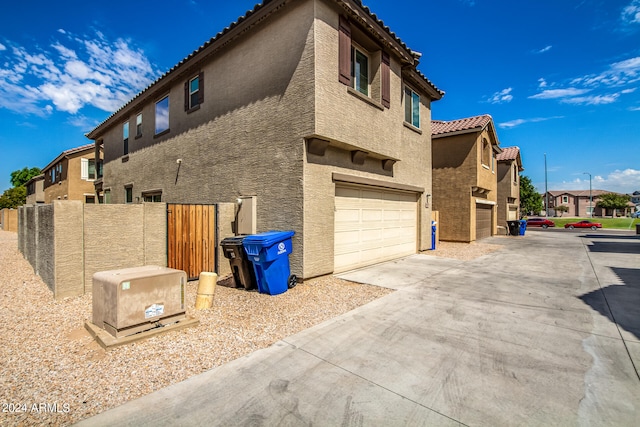 view of side of property with a garage