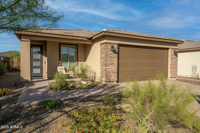 4539 Charro Ct, Wickenburg, AZ 85390 - view of front facade with stucco siding, concrete driveway, a garage, stone siding, and a tiled roof