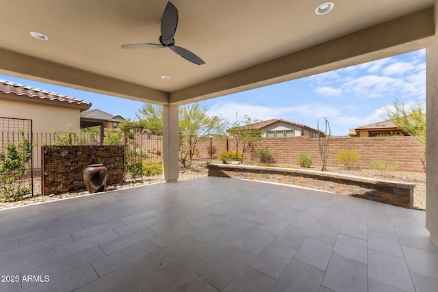 4539 Charro Ct, Wickenburg, AZ 85390 - fenced backyard featuring ceiling fan and a patio