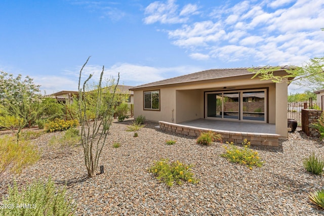 4539 Charro Ct, Wickenburg, AZ 85390 - back of property with stucco siding and a patio