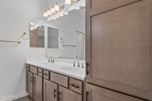 4539 Charro Ct, Wickenburg, AZ 85390 - bathroom with double vanity, wood finished floors, and baseboards