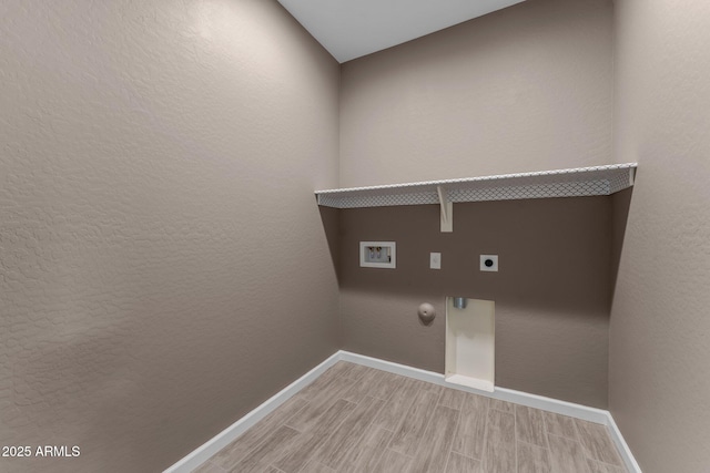 4539 Charro Ct, Wickenburg, AZ 85390 - laundry room featuring hookup for an electric dryer, baseboards, light wood-style flooring, gas dryer hookup, and hookup for a washing machine