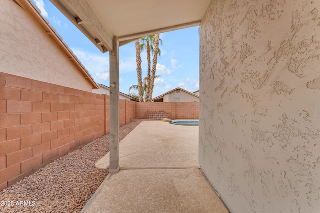 view of patio featuring a fenced backyard