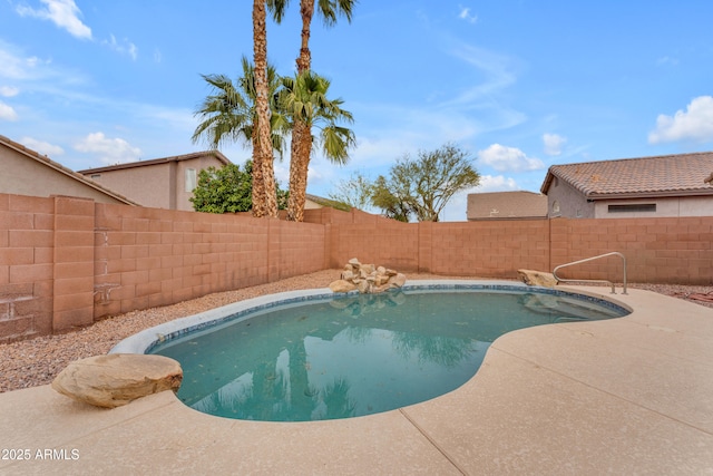 view of swimming pool featuring a fenced backyard and a fenced in pool